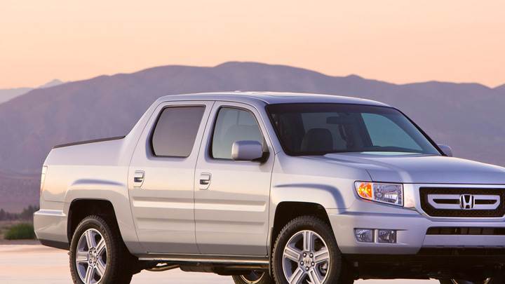 2009 Honda Ridgeline Side Pose In Silver Near Mountains